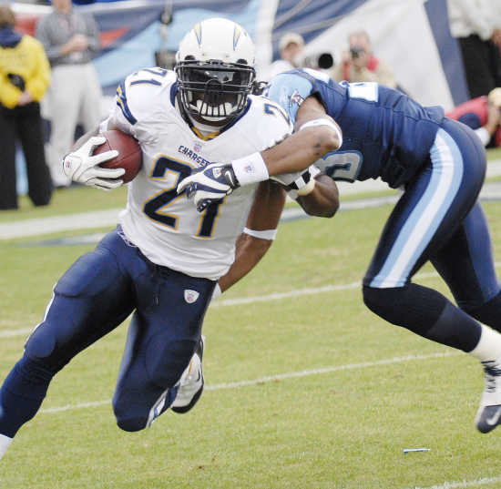 San Diego Chargers running back LaDainian Tomlinson (21) stiff arms  Tennessee Titans Michael Griffin in the second quarter at Qualcomm Stadium  in San Diego, California on January 6, 2008 during the AFC